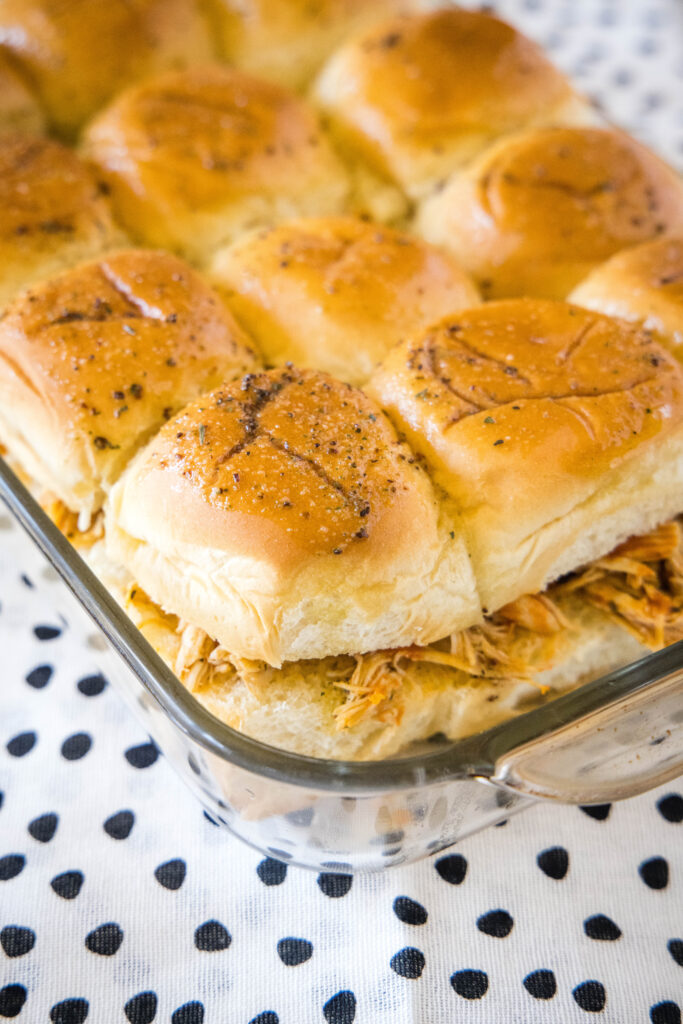 baked buffalo chicken sliders in a baking dish