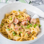 cropped in close up of cajun pasta skillet in a white bowl