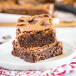 cropped close up of brownies on a white plate