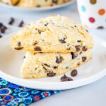 cropped in close up of stacked scones on a white plate