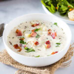 cropped in close up of a bowl of clam chowder