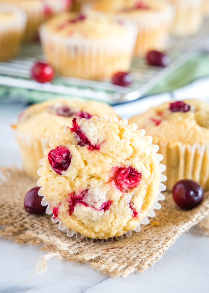 cranberry muffins on a white table