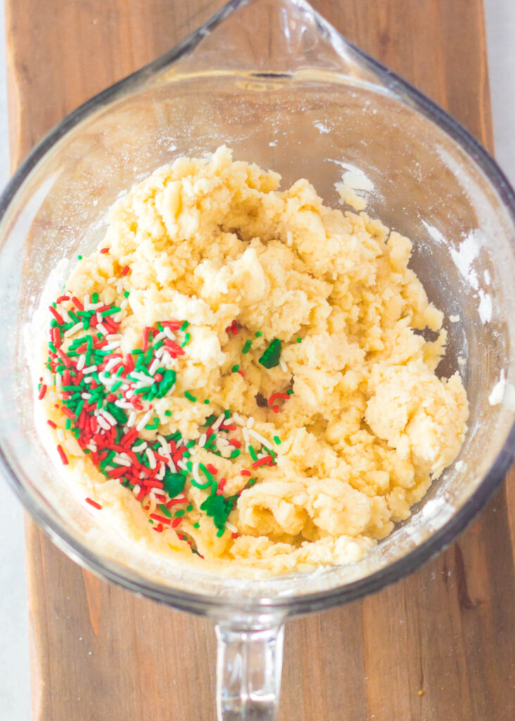 sugar cookie dough in a mixing bowl with sprinkles