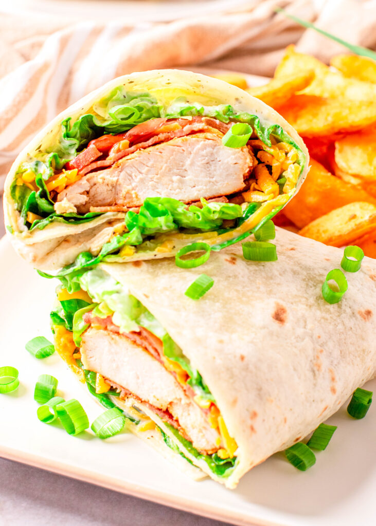 chicken wrap cut in half and stacked on a plate