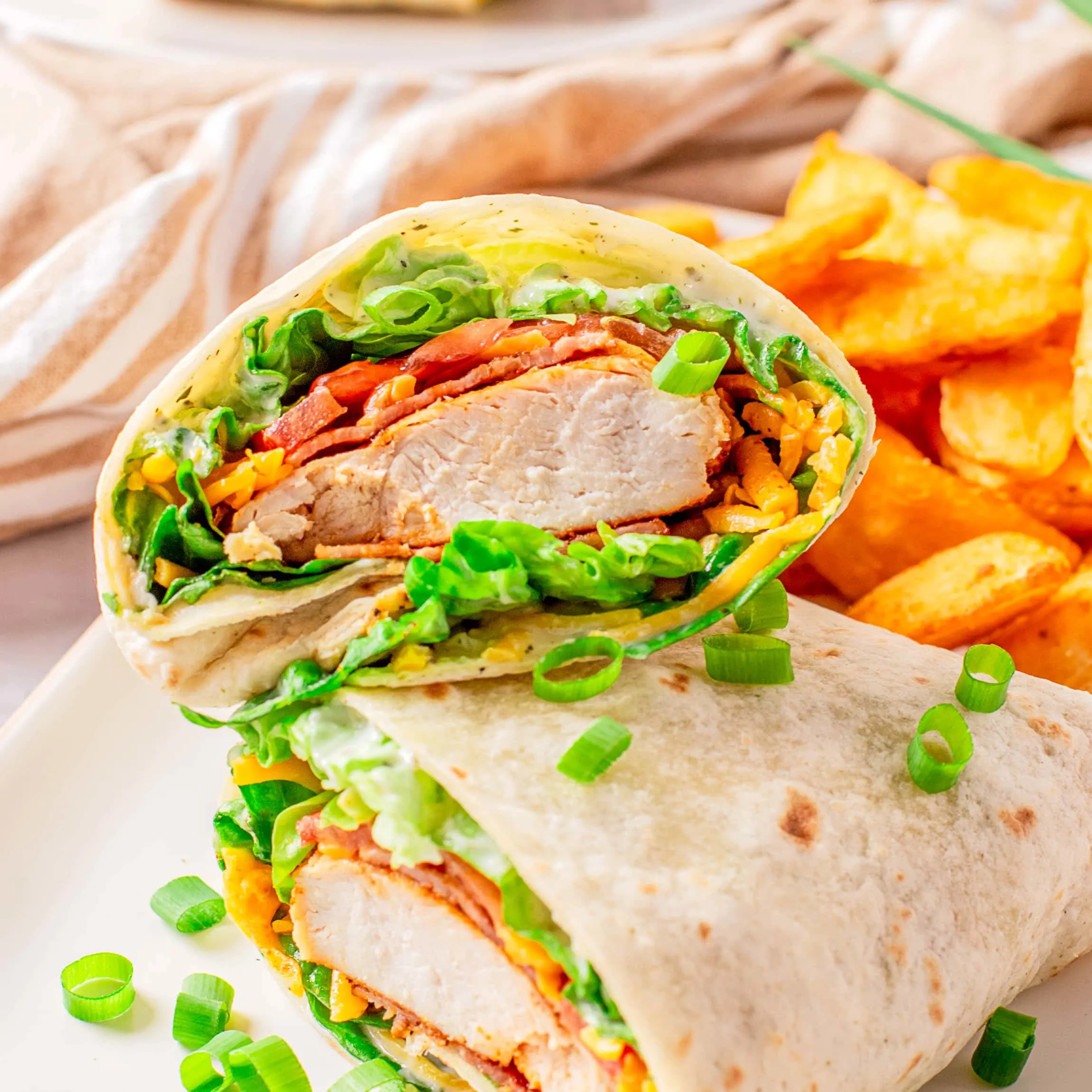 cropped in close up of chicken bacon ranch wrap
