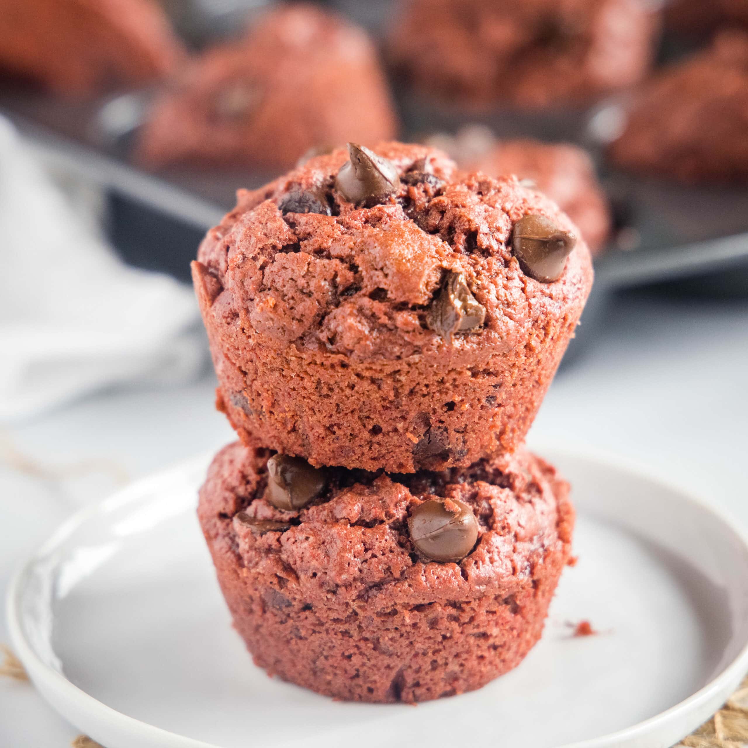 cropped in close up of stacked red velvet muffins