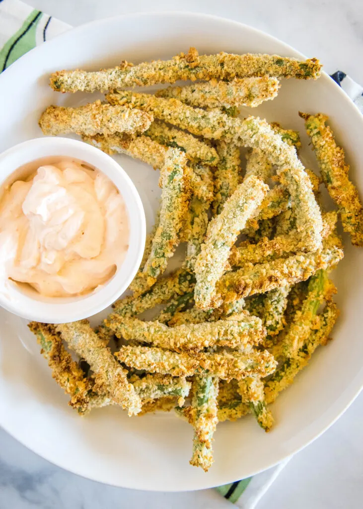 looking down on a plate of air fryer green bean fries