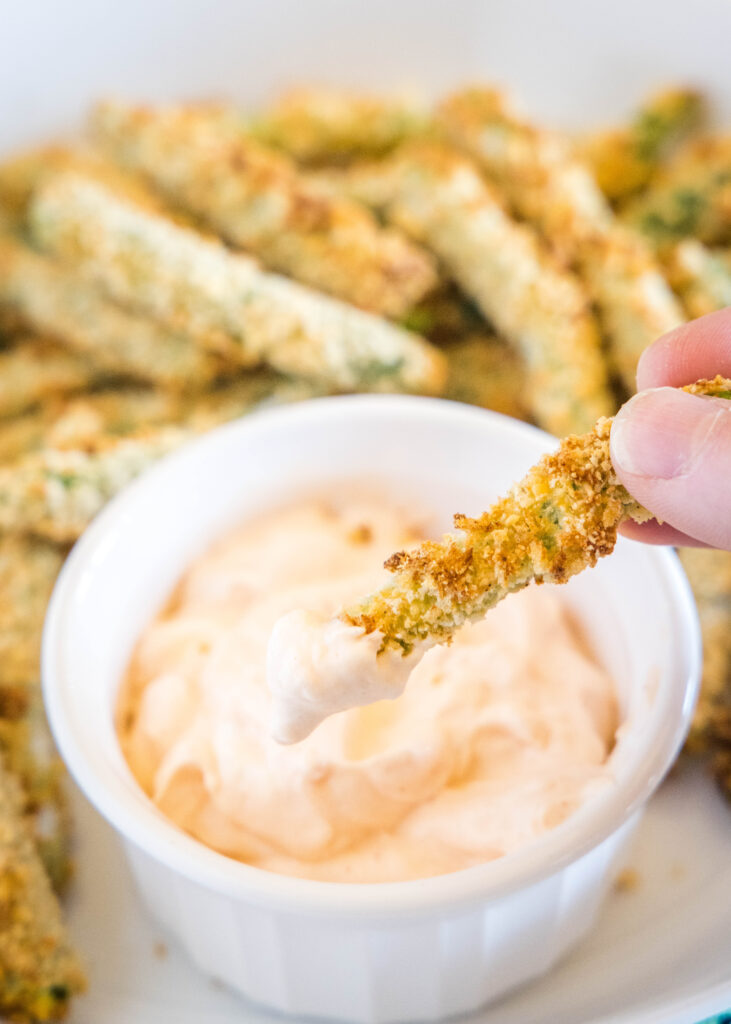 dipping green bean fries in spicy mayo