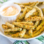 cropped in close up of air fryer green bean fries