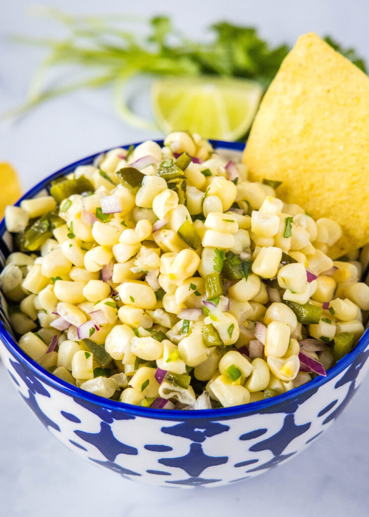 roasted chili corn salsa in a blue and white bowl