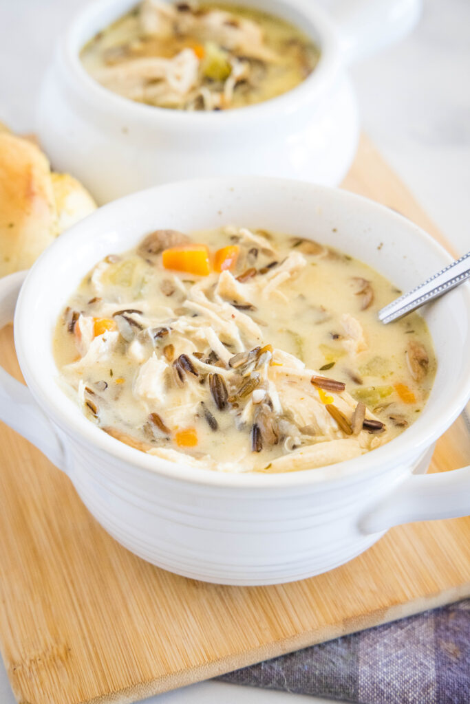 chicken wild rice soup in a bowl with a spoon