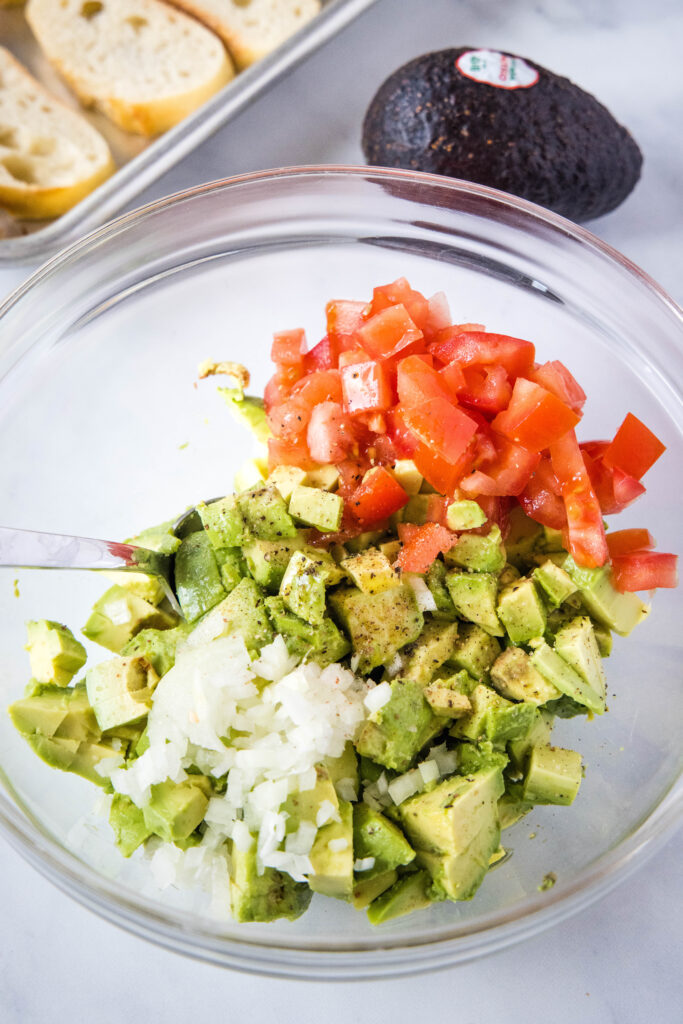 avocado topping ingredients in a mixing bowl avocado bruschetta | dinners, dishes, and desserts - Avocado Bruschetta 2 683x1024 - Avocado Bruschetta | Dinners, Dishes, and Desserts