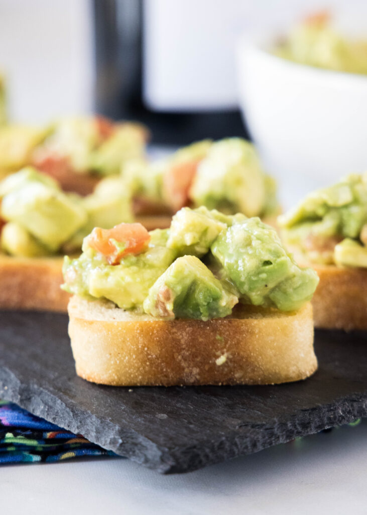 serving tray with avocado toast avocado bruschetta | dinners, dishes, and desserts - Avocado Bruschetta 8 731x1024 - Avocado Bruschetta | Dinners, Dishes, and Desserts