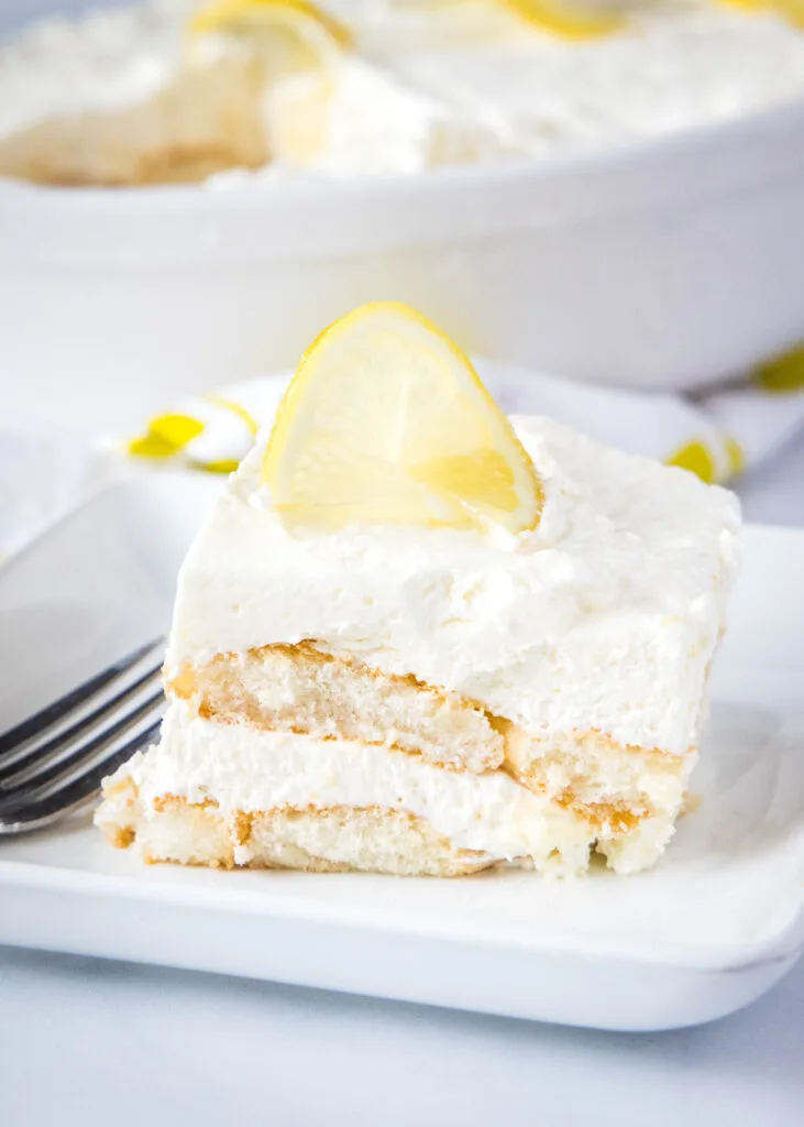 slices of limoncello tiramisu on a white plate with a fork