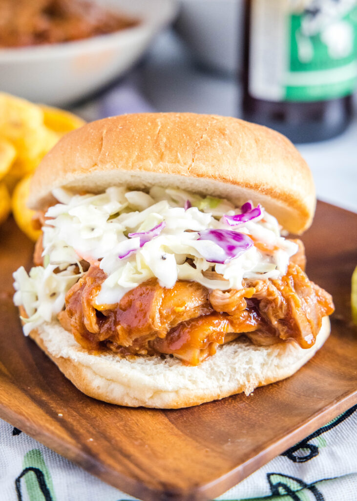 barbecue pulled pork sandwich with coleslaw on a plate