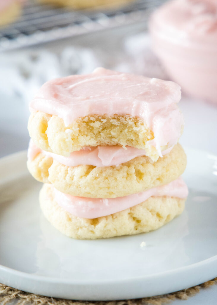 a stack of bakery style sugar cookies on a plate