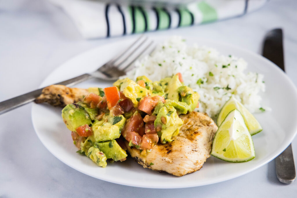 Grilled Avocado Chicken - perfectly tender and juicy grilled chicken topped with an avocado and tomato salsa. A healthy, fresh and easy dinner any night of the week.