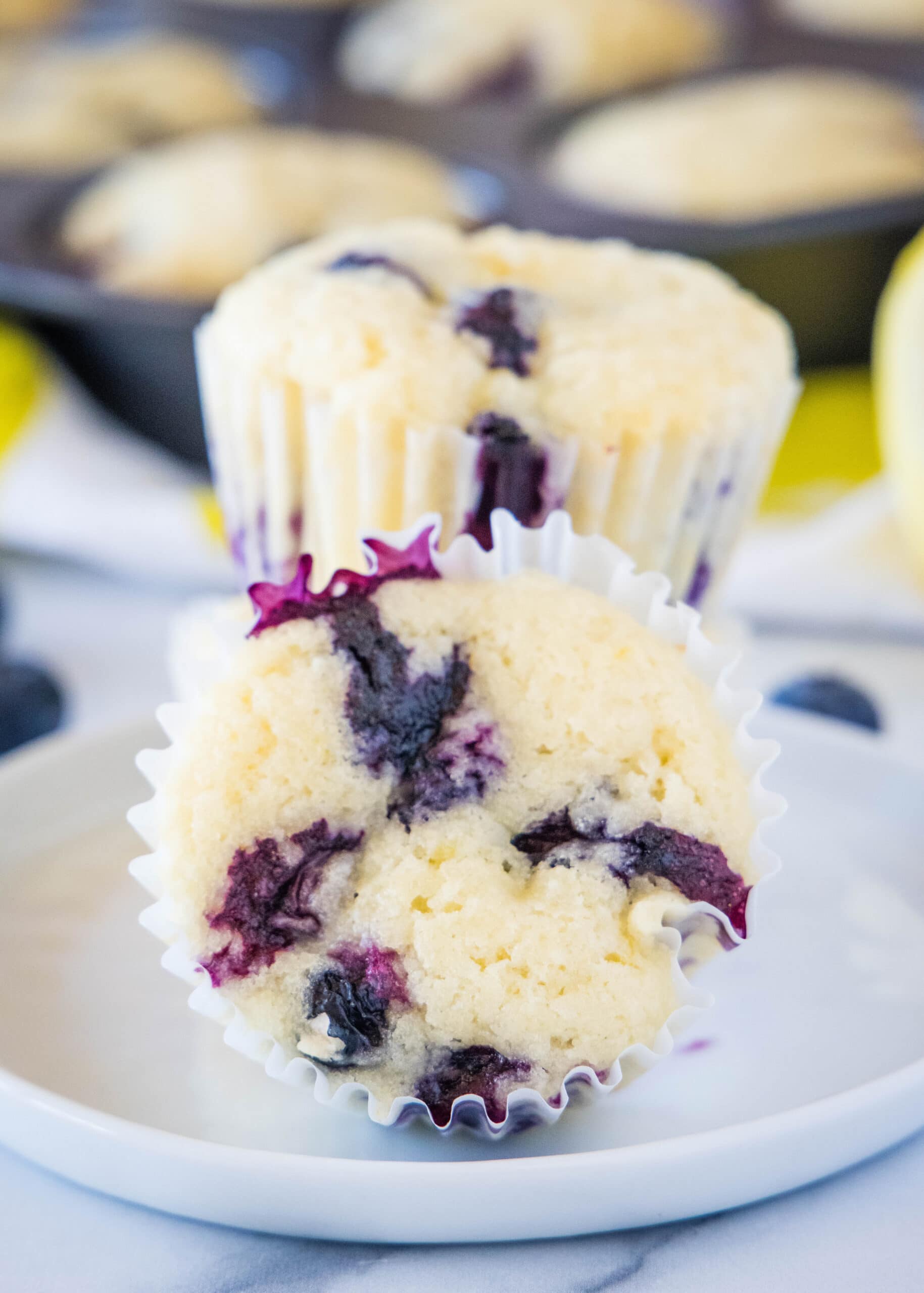 lemon blueberry muffins on a white plate