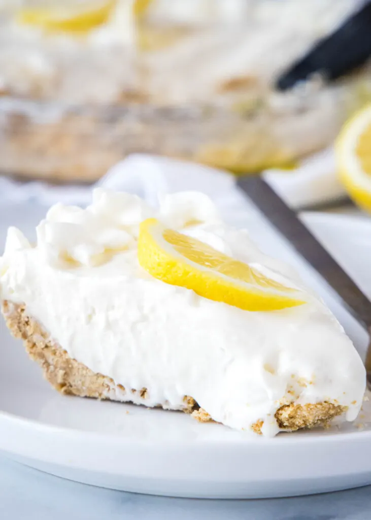 creamy lemonade pie on a white plate