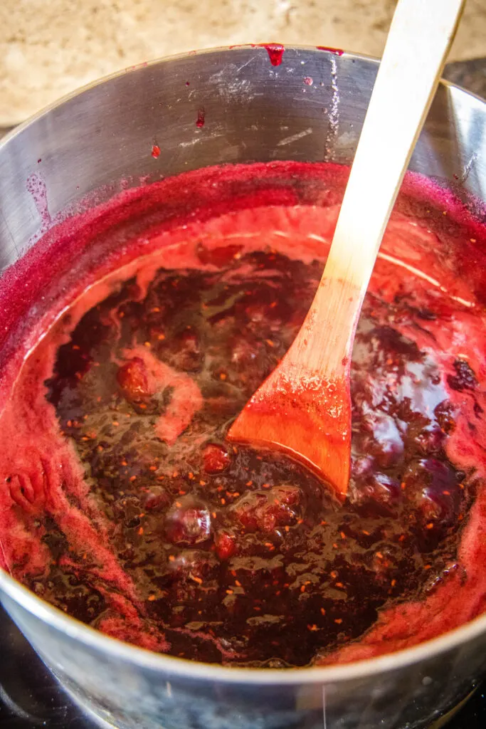 cooking berry jam in a large pot