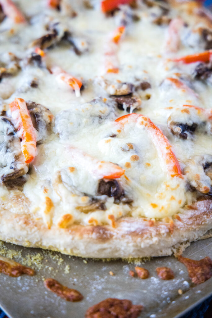 baked philly cheesesteak pizza on baking sheet philly cheesesteak pizza - dinners, dishes, and desserts - Philly Cheesesteak Pizza 3 683x1024 - Philly Cheesesteak Pizza &#8211; Dinners, Dishes, and Desserts