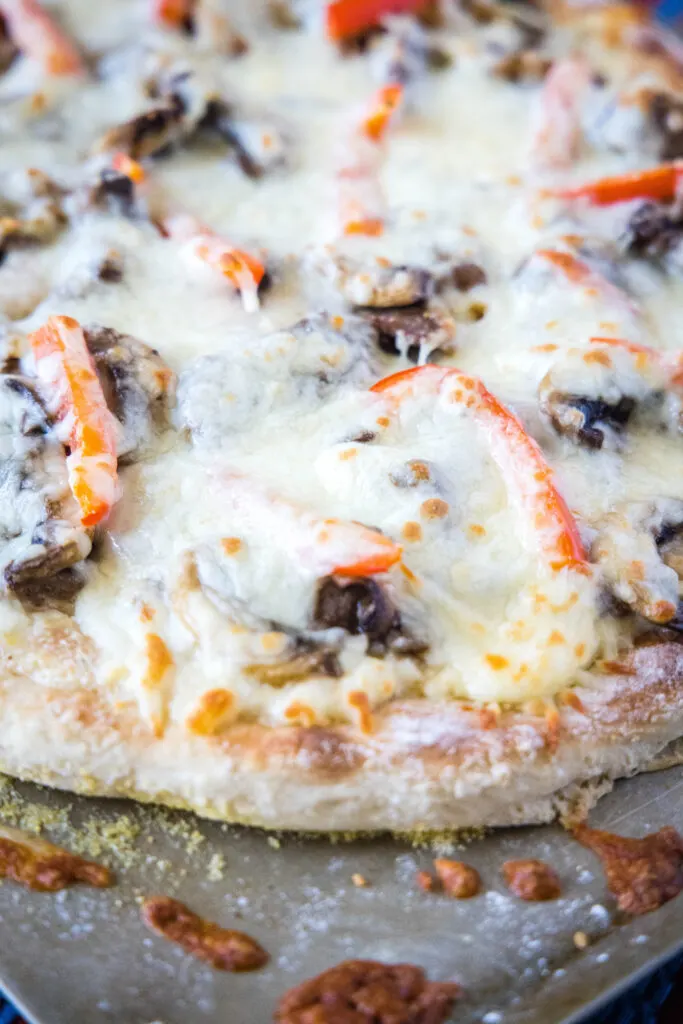 baked philly cheesesteak pizza on baking sheet