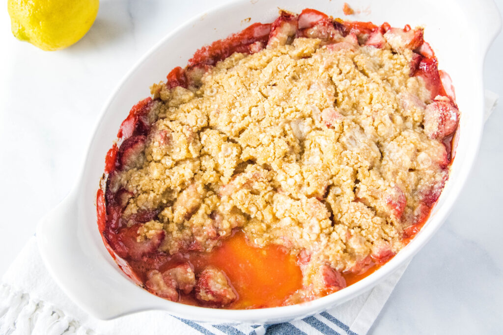 Strawberry Crumble - the perfect dessert for fresh strawberries! Juicy strawberries with a buttery brown sugar crumble topping. Serve with a scoop of ice cream for a decadent treat!