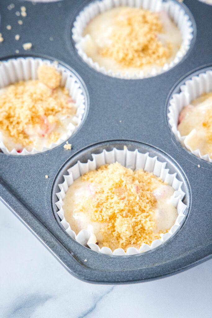 muffin batter with brown sugar sprinkled on top strawberry rhubarb muffins - dinners, dishes, and desserts - Strawberry Rhubarb Muffins 2 683x1024 - Strawberry Rhubarb Muffins &#8211; Dinners, Dishes, and Desserts