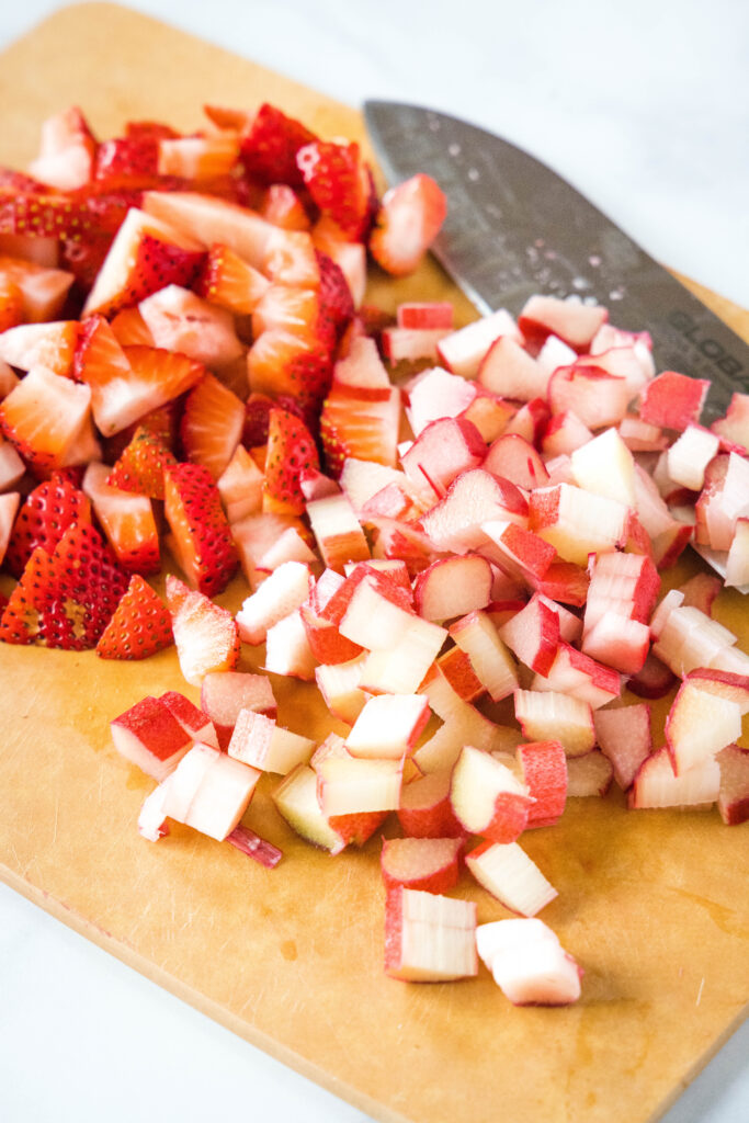 chopped strawberries and rhubarb on a cutting board strawberry rhubarb muffins - dinners, dishes, and desserts - Strawberry Rhubarb Muffins 683x1024 - Strawberry Rhubarb Muffins &#8211; Dinners, Dishes, and Desserts