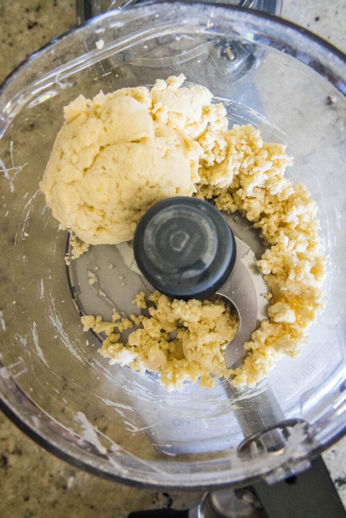 ball of pasta dough in food processor