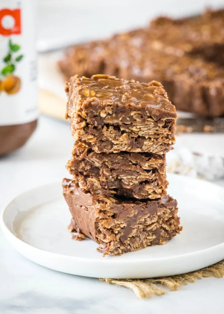 stacked no bake nutella bars on a white plate