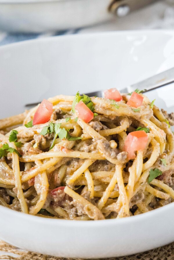 close up of taco spaghetti in a white bowl