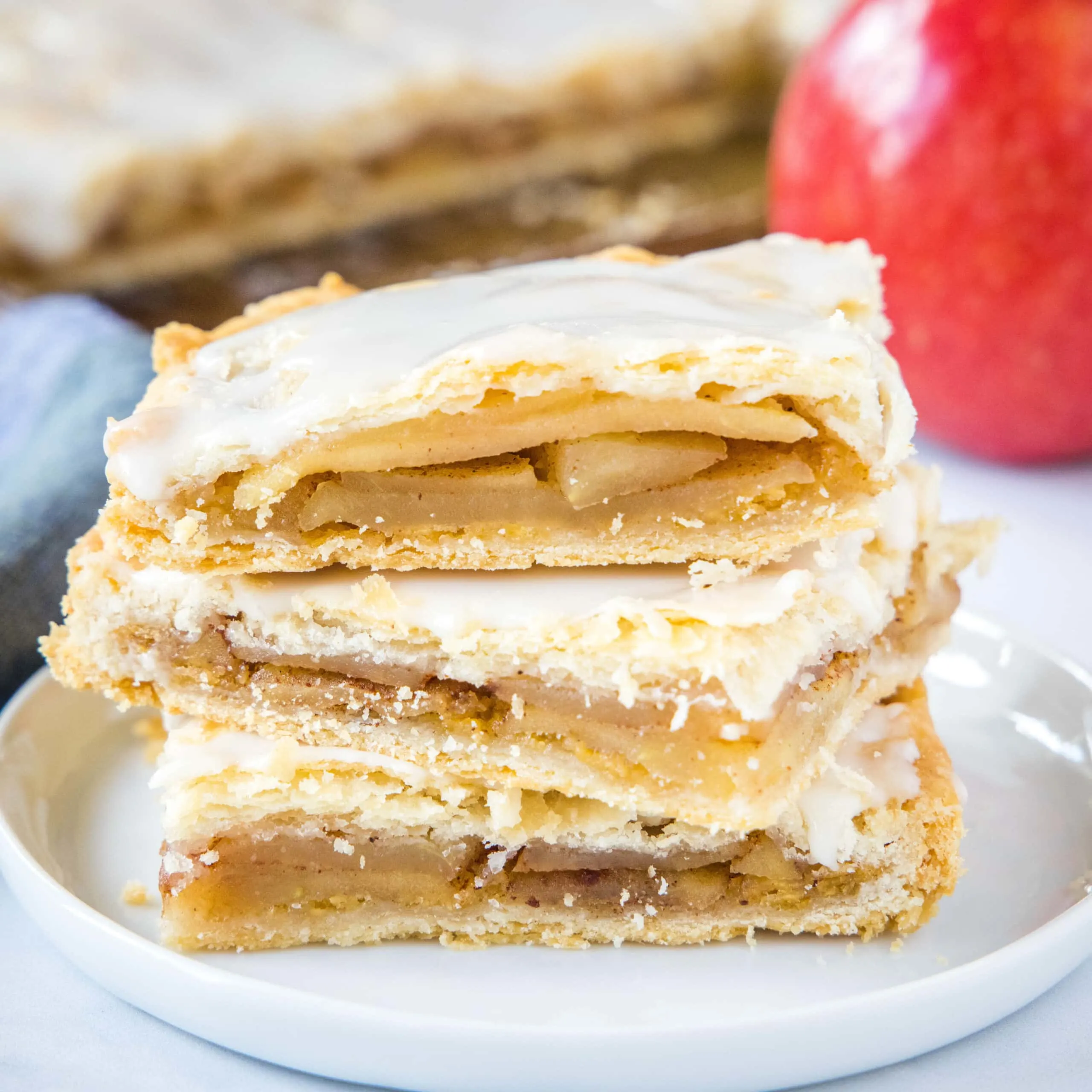 close up apple bars stacked on a plate