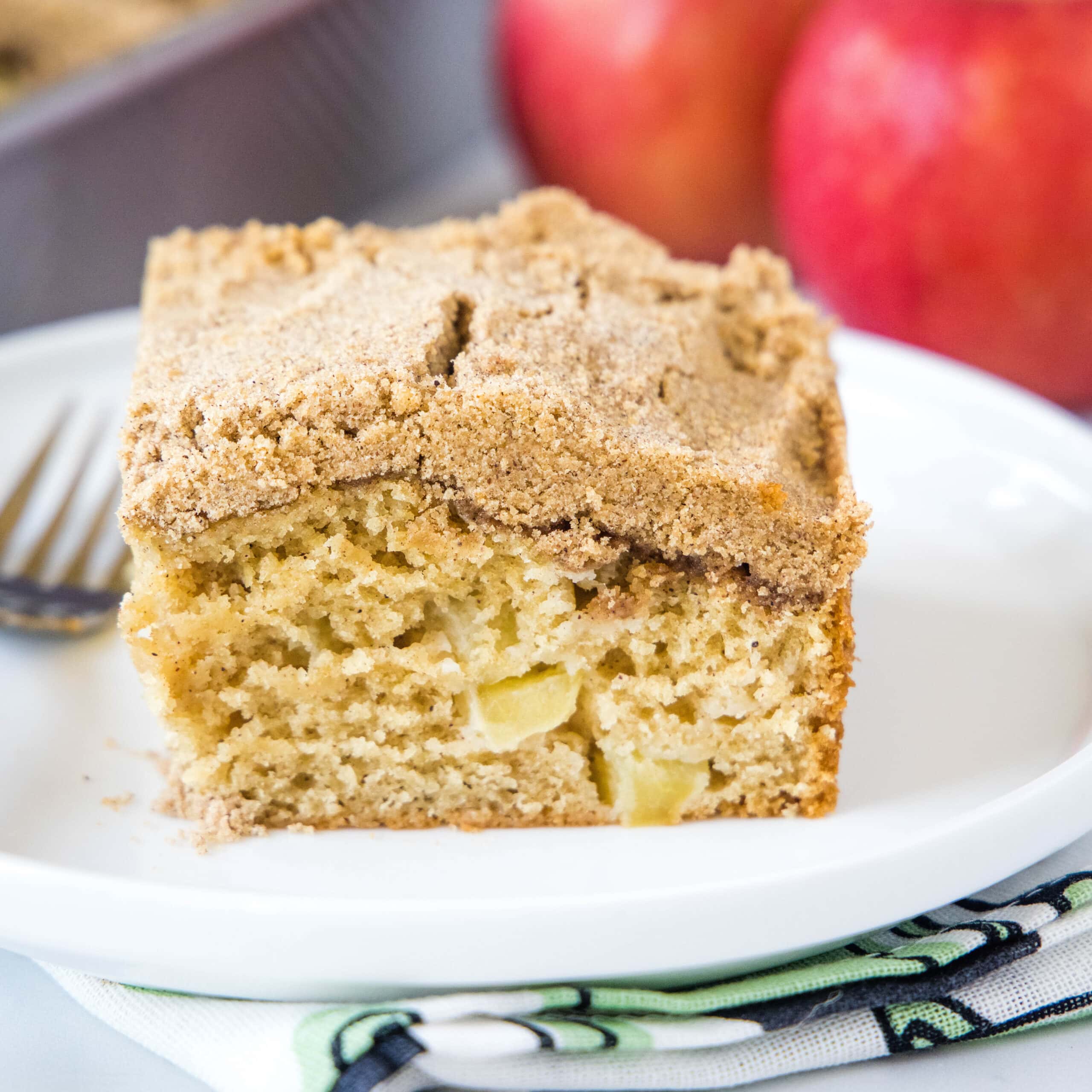 cropped in image of apple coffee cake on a plate with a fork