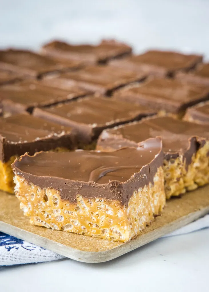 cut cookie butter rice krispie treats on a cutting board