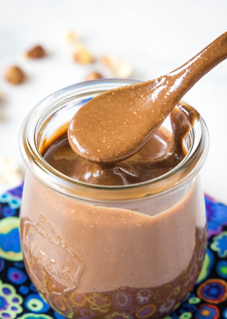 a jar of homemade nutella with a spoon in it