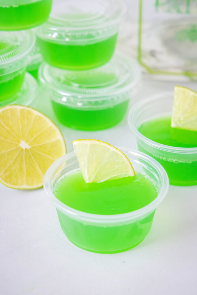 jello shots with tequila and margarita mix with a slice of lime