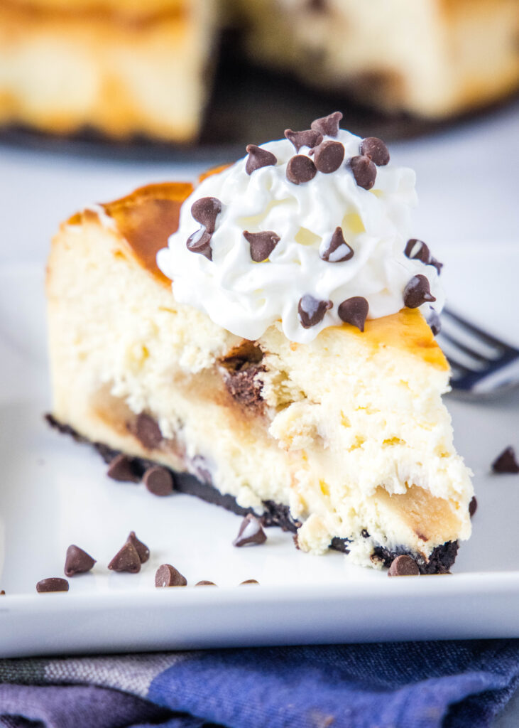 cookie dough cheesecake on a plate with a fork