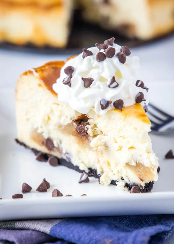 cookie dough cheesecake on a plate with a fork
