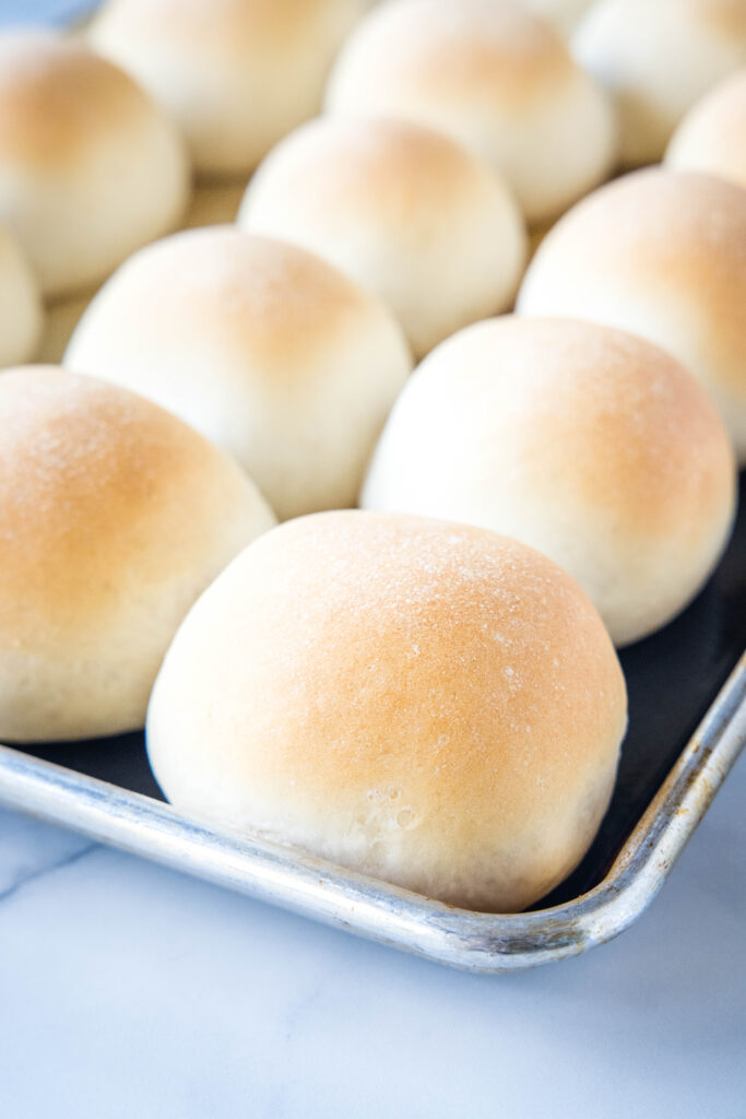baked french rolls on a baking sheet