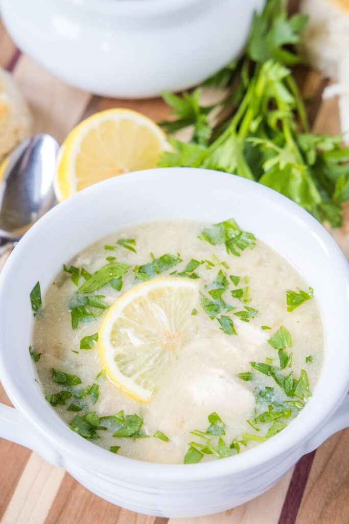 lemon chicken and rice soup in a white bowl