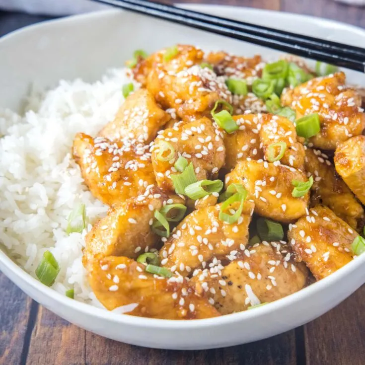 cropped in image of bourbon chicken topped with sesame seeds