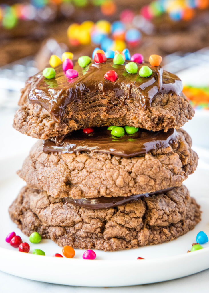 stack of cosmic brownie cookies with a bite missing