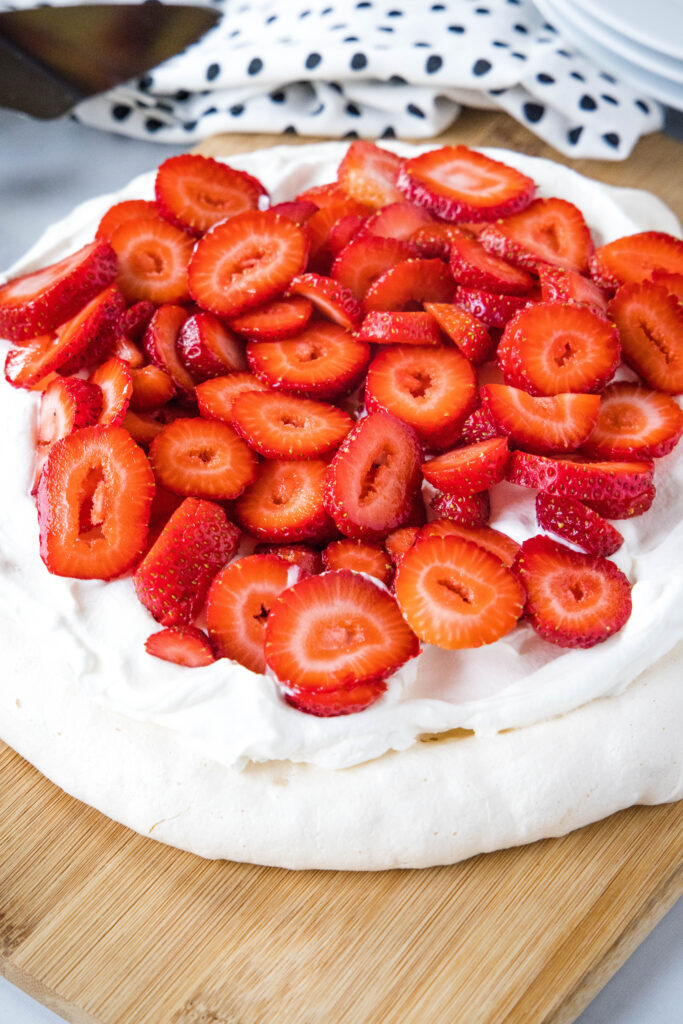 pavlova with whipped cream and strawberries