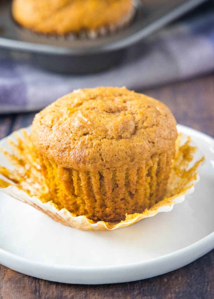 pumpkin cream cheese muffin with the paper liner off