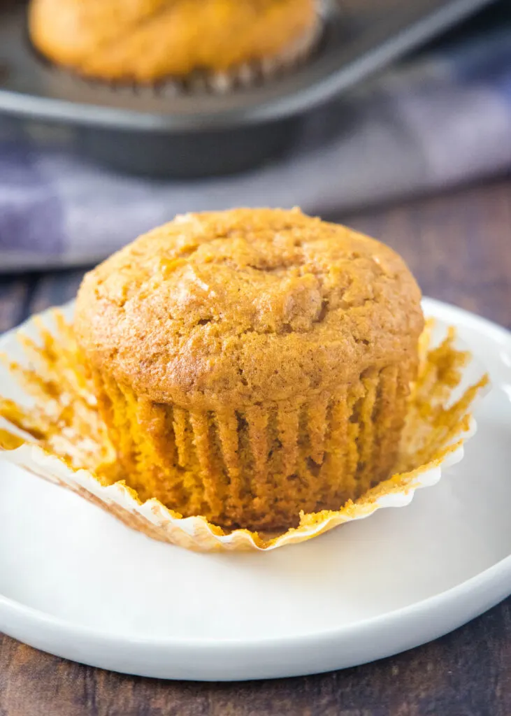 pumpkin cream cheese muffin with the paper liner off