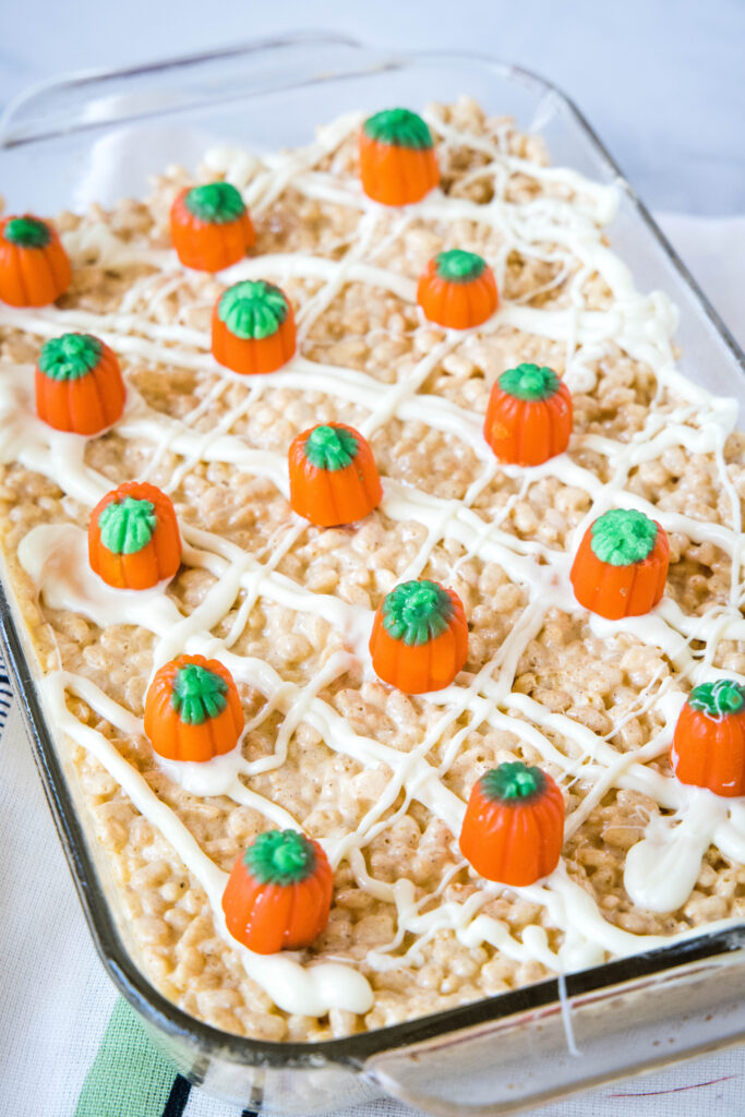 rice krispie treats with pumpkin in a baking dish