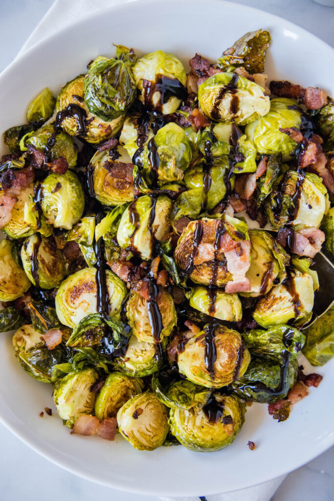 balsamic glaze drizzled on a bowl of brussel sprouts