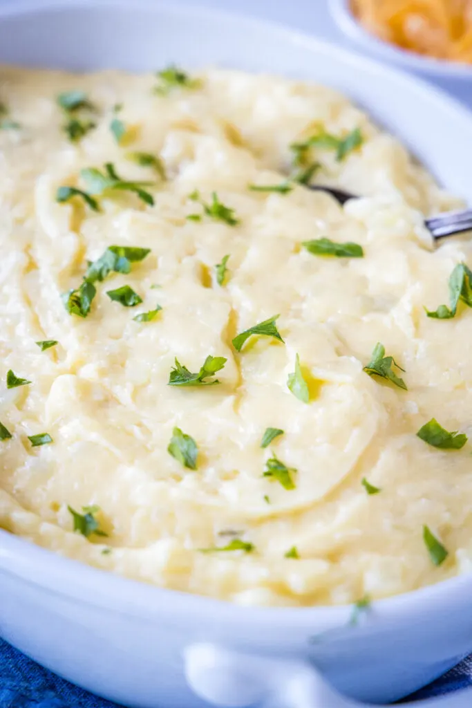 a baking dish with cheddar mashed potatoes