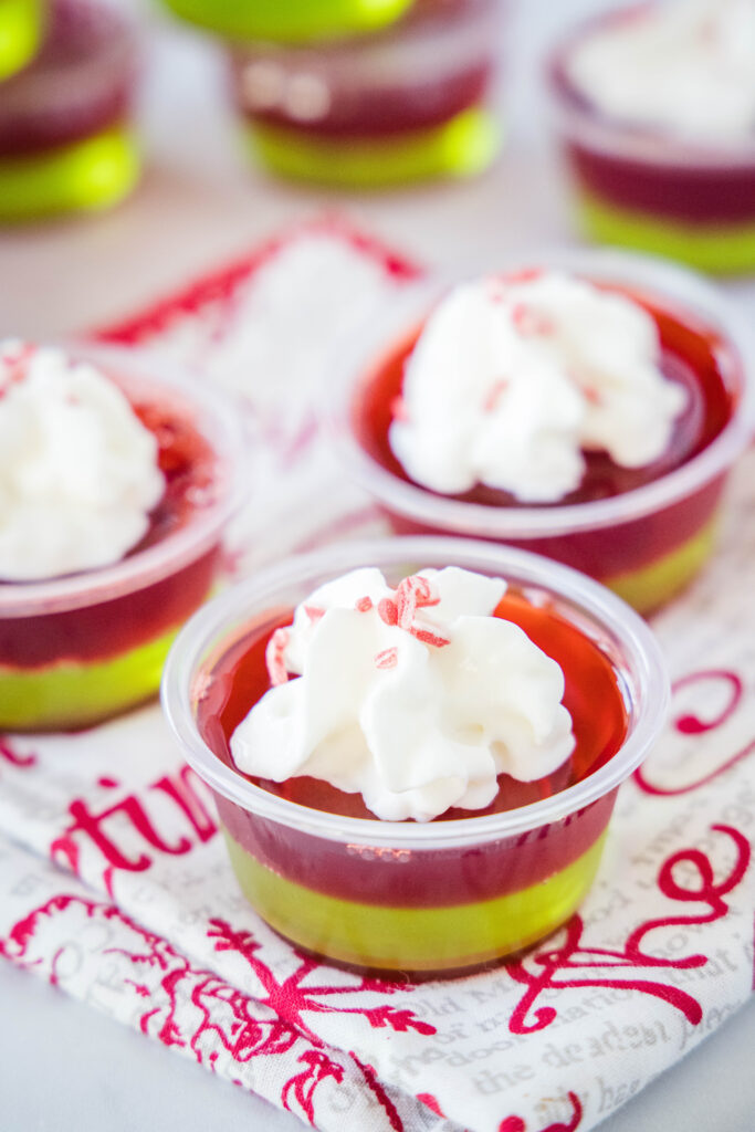 christmas layered jello shots with whipped cream